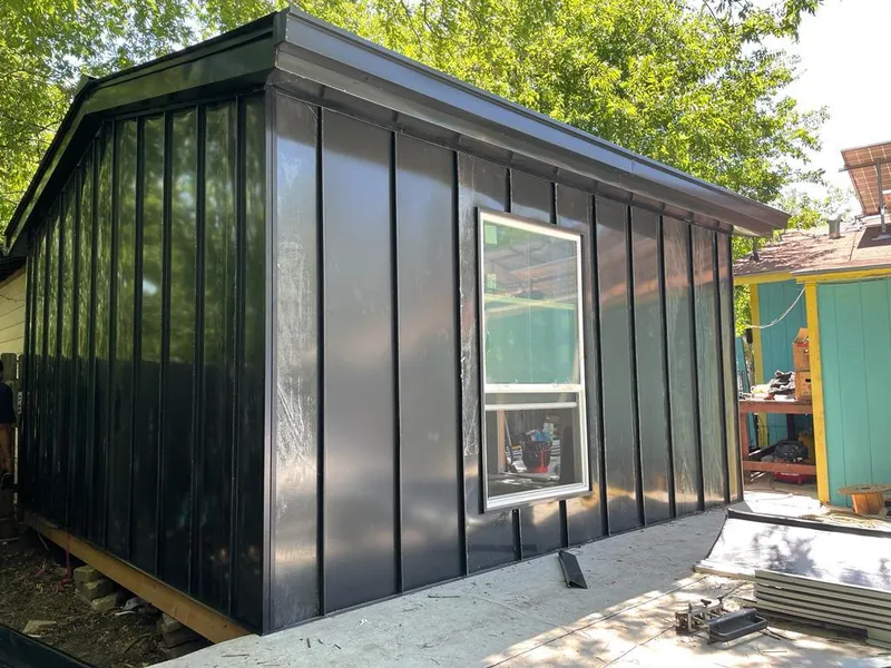 Black standing seam metal wall panels for Roof Inspection in Camden